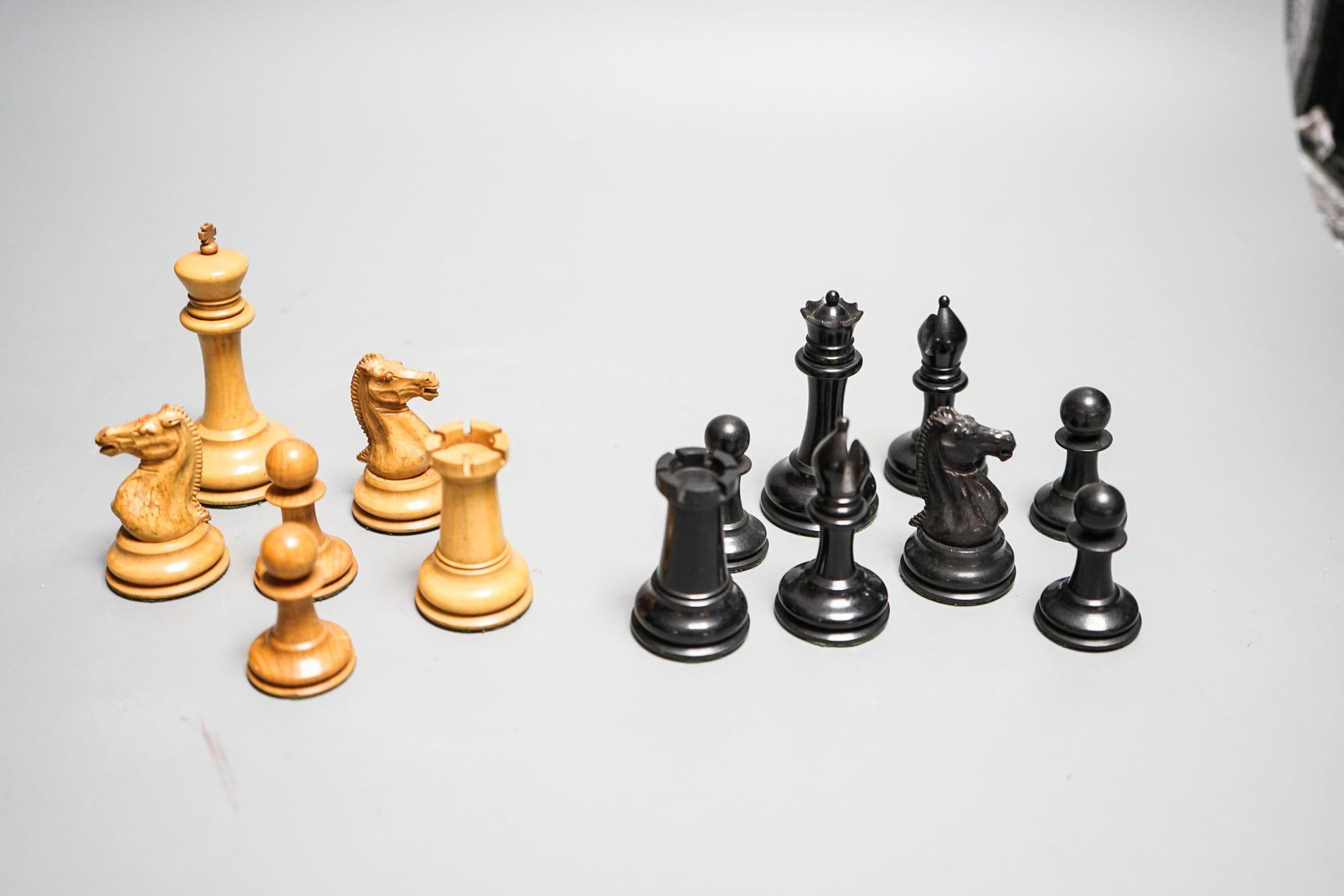 A boxed Jaques Staunton boxwood and ebony chess set, White king stamped Jaques London, 8.5cm high